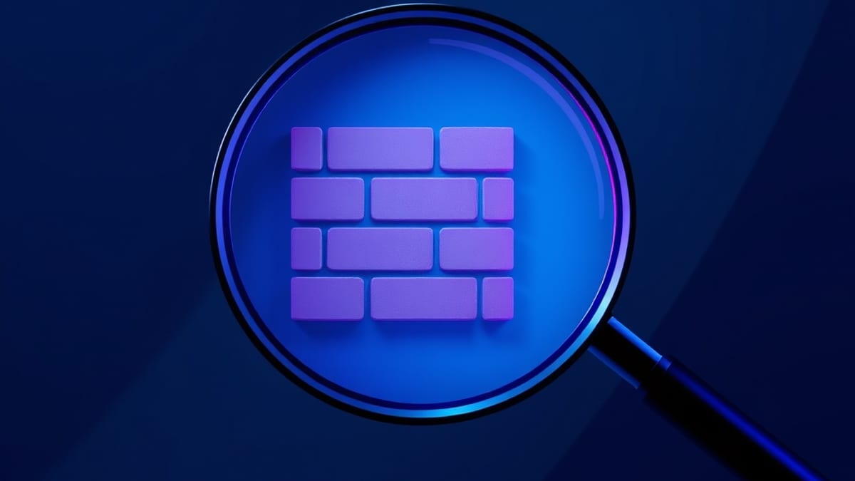 A magnifying glass highlights one brick in a wall while the surrounding bricks dissolve into fog.