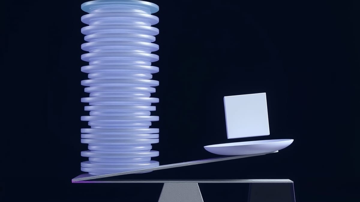 A balance beam tilting under a tall stack of translucent plates, opposed by one small solid cube on the other pan.