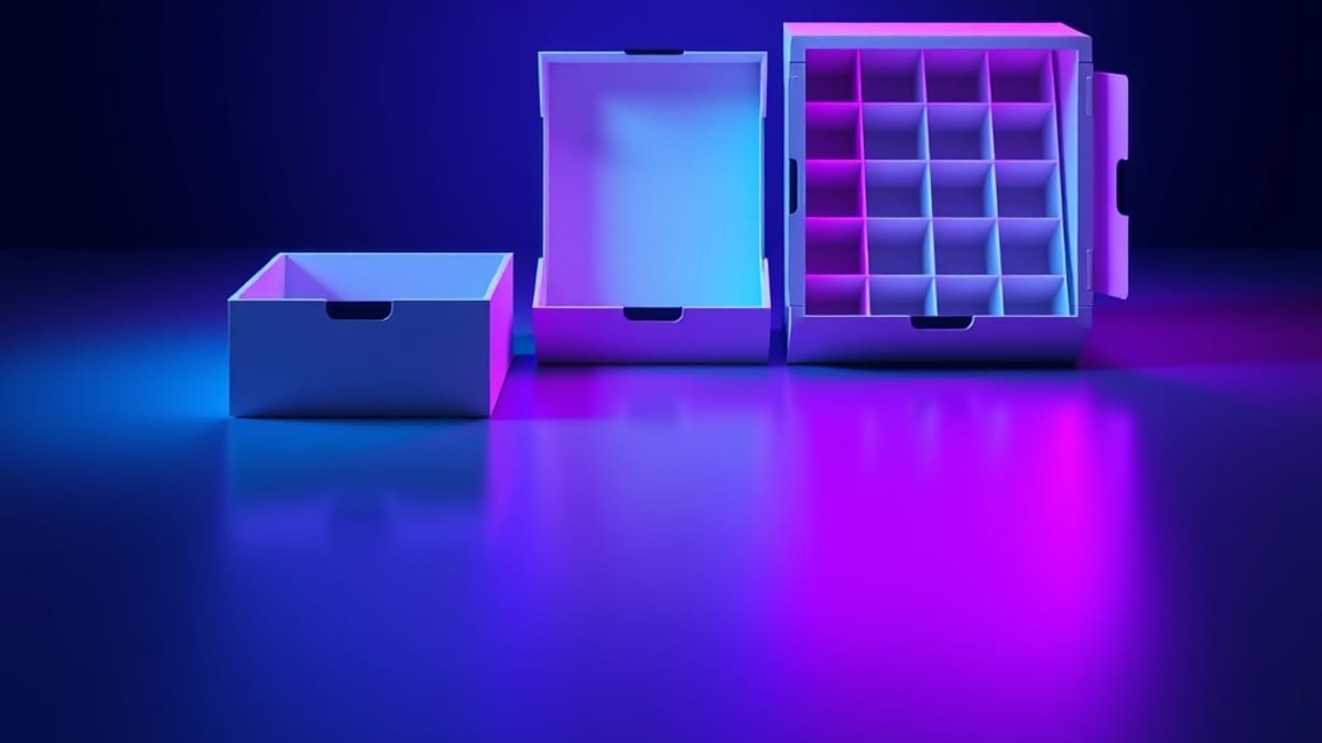 Three same-looking boxes of different sizes, each containing a different number of internal compartments, under soft light.
